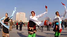 People of the Tibet ethnic group perform Guozhuang, a Tibetan Bonfire Dance, in Xining, capital of northwest China's Qinghai Province, September 24, 2009.