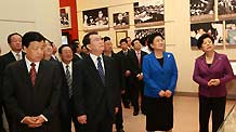 Li Changchun (2nd L front), member of the Standing Committee of the Political Bureau of the Communist Party of China (CPC) Central Committee, visits the exhibition 'Road of Rejuvenation' after its opening ceremony in Beijing, capital of China, September 25, 2009.