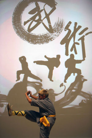 A German boy performs Chinese martial art in an evening to celebrate the 60th anniversary of founding of the People's Republic of China in Berlin, capital of Germany, September 24, 2009.