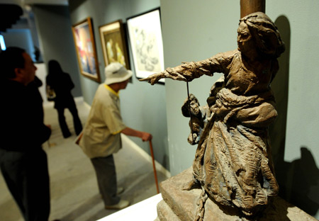 People visit the exhibition titled 'Footstone, the 60 years past' in Beijing, capital of China, September 26, 2009.