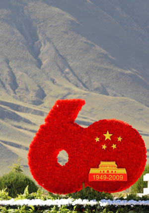 The Big '60' is erected along with flowers decoration in Lhasa, capital of southwest China's Tibet Autonomous Region, September 26, 2009.