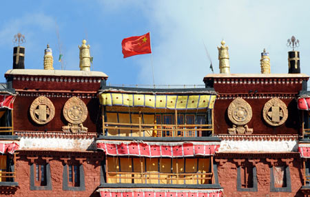 The Chinese flags are floating above the Potala Palace in Lhasa, capital of southwest China's Tibet Autonomous Region, September 26, 2009. 