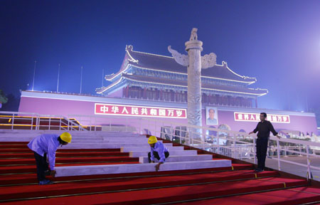 Workers assemble the temporary reviewing stands on the both sides of Tiananmen rostrum for China&apos;s 60th National Day celebrations in Beijing, capital of China, September 25, 2009. 