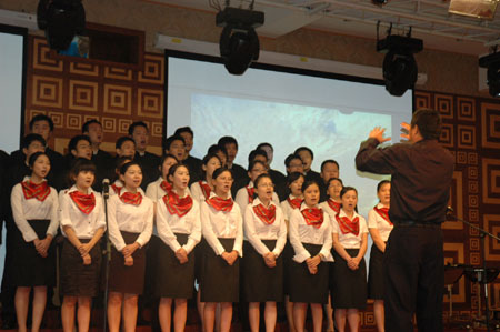 Staff members of a company of south China's Hong Kong perform during a celebration to mark the upcoming 60th anniversary of the founding of the People's Republic of China, in Lagos, Nigeria, September 26, 2009.