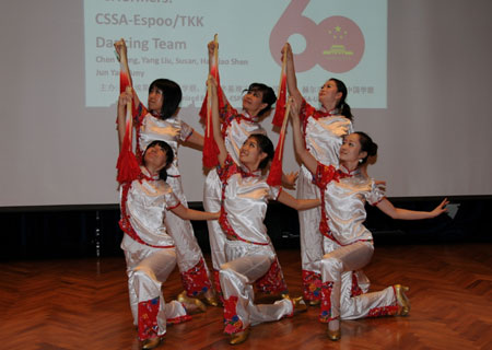 Performers dance during a celebration to mark the upcoming 60th anniversary of the founding of the People's Republic of China, in Helsinki, Finland, September 26, 2009. 