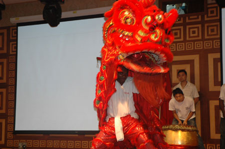 A Nigerian performs lion dance during a celebration to mark the upcoming 60th anniversary of the founding of the People's Republic of China, in Lagos, Nigeria, September 26, 2009.