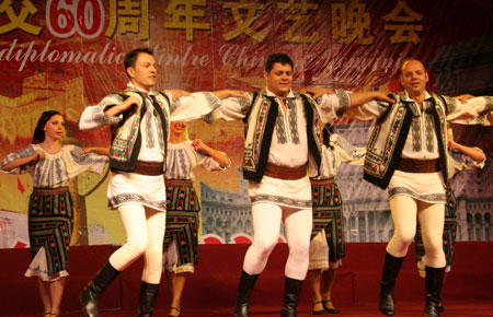  Romanian dancers perform folk dance during a celebration to mark the upcoming 60th anniversary of the founding of the People's Republic of China, in Bucharest, Romania, September 26, 2009. 