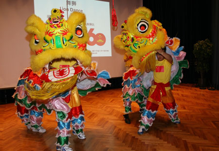 Performers perform lion dance during a celebration to mark the upcoming 60th anniversary of the founding of the People's Republic of China, in Helsinki, Finland, September 26, 2009.