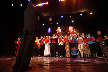 Overseas Chinese and Chinese Ambassador to Mexico Yin Hengmin (8th R, front) perform during a celebration to mark the upcoming 60th anniversary of the founding of the People's Republic of China, in Mexico City, capital of Mexico, September 26, 2009. 