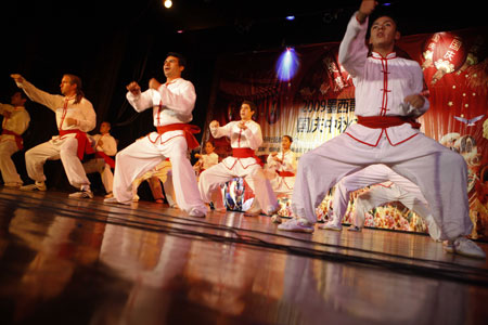 Students from local Kung-fu school perform Chinese Kung-fu during a celebration to mark the upcoming 60th anniversary of the founding of the People's Republic of China, in Mexico City, capital of Mexico, September 26, 2009.