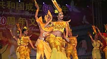 Overseas Chinese dance during a celebration to mark the upcoming 60th anniversary of the founding of the People's Republic of China, in Mexico City, capital of Mexico, September 26, 2009.
