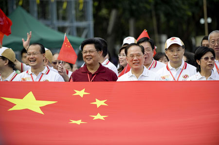 Chief Executive of China's Hong Kong Special Administrative Region (HKSAR) Donald Tsang Yam-kuen (2nd R, Front) attends a charity walk in Hong Kong, south China, on September 27, 2009.