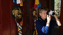 A German tourist takes photo in the street in Lhasa, capital of southwest China's Tibet Autonomous Region, on September 27, 2009.