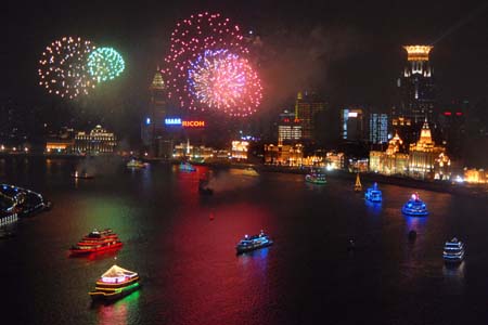 Fireworks are seen over the Huangpujiang River, during a festival fireworks show together with the festooned ships cruise over the Huangpujiang River to intensify the happy festival atmosphere to usher in the forthcoming 60th anniversary of the founding of the People's Republic of China, in Shanghai, east China, September 28, 2009. 