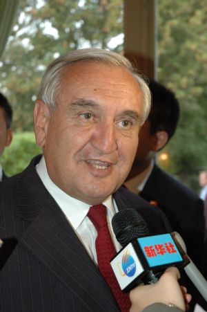 Former French Prime Minister Jean-Pierre Raffarin is interviewed during a reception held at a garden in Paris, capital of France, on September 28, 2009. 