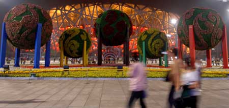 This picture taken on September 28, 2009 shows Bird's Nest illuminated with lights. With the coming of the National Day of China, the nights of Beijing become more charming with many places and buildings illuminated by lights.