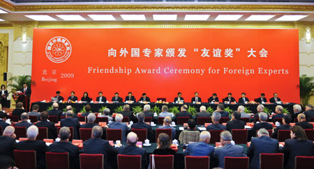 The Friendship Award Ceremony for Foreign Experts is held at the Great Hall of the People in Beijing, capital of China, Sept. 29, 2009. Chinese government on Tuesday conferred the Friendship Award, the country's highest award for foreign experts, to 100 foreigners for their contribution to its economic and social development. Chinese Vice Premier Zhang Dejiang gave a medal and certificate to each of 100 experts from 28 different countries at the ceremony.