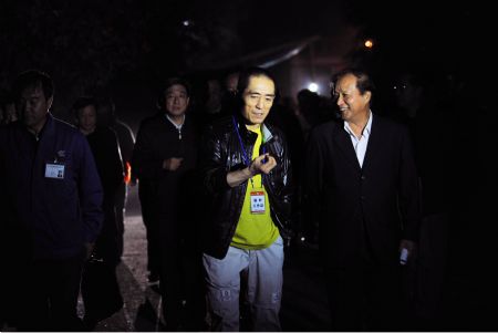 Photo taken on September 8, 2009 shows Zhang Heping (R), deputy director and art majordomo of an evening party marking the 60th anniversary of the founding of the People&apos;s Republic of China, talks to Zhang Yimou in Beijing. 