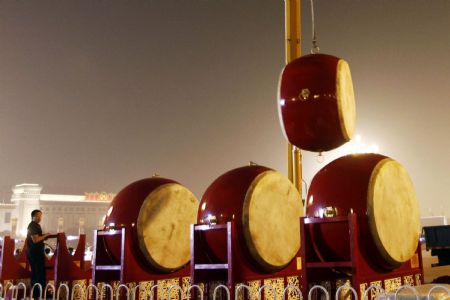 Staff members adjust drums which will be used at the National Day celebrations at Tian&apos;anmen Square, Beijing, September 29, 2009. 