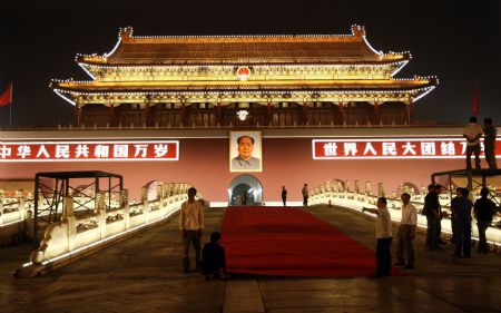 Staff members lay red carpet which will be used at the National Day celebrations in front of the Tian&apos;anmen Rostrum, Beijing, September 29, 2009.