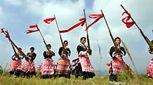 People of Miao ethnic group perform lusheng dance in Longli County, southwest China's Guizhou Province, September 29, 2009.