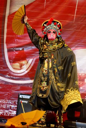 An actor performs face-changing art during a soiree to celebrate the 60th anniversary of the founding of the People's Republic of China, in Kuala Lumpur, Malaysia, on September 29, 2009.