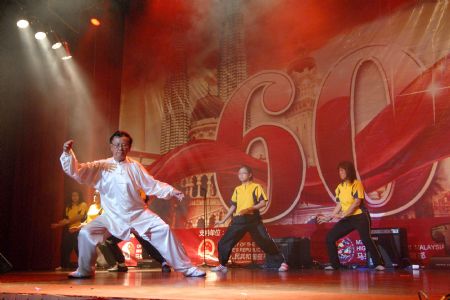 An overseas Chinese performs Taiji during a soiree to celebrate the 60th anniversary of the founding of the People's Republic of China, in Kuala Lumpur, Malaysia, on September 29, 2009. 