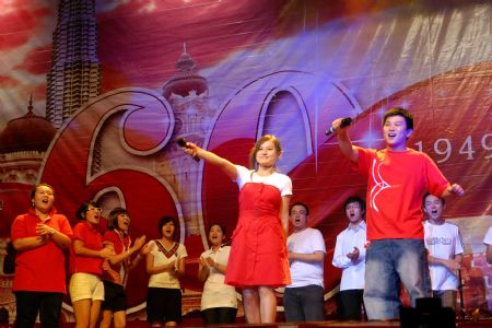 Chinese students studying in Malaysia perform during a soiree to celebrate the 60th anniversary of the founding of the People's Republic of China, in Kuala Lumpur, Malaysia, on September 29, 2009. 