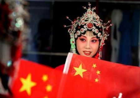 One beauty school student displays her special National Day make-up before a party to celebrate the National Day and Mid-Autumn Festival, at Longshou North Road in the city of Xi&apos;an, on September 28, 2009. 