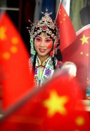 One beauty school student displays her special National Day make-up before a party to celebrate the National Day and Mid-Autumn Festival, at Longshou North Road in the city of Xi&apos;an, on September 28, 2009.