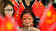 Students from a beauty school in Xi'an city put on innovative make-up specially designed for celebrating the National Day, on September 28, 2009.