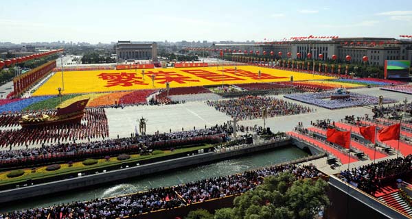 The background phalanxes form Chinese characters meaning 'Thriving and Prosperous' during the celebrations for the 60th anniversary of the founding of the People's Republic of China, in central Beijing, capital of China, October 1, 2009. 