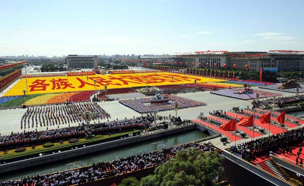 The background phalanxes form Chinese characters meaning 'Viva the unity of the people of all ethnic groups of China' during the celebrations for the 60th anniversary of the founding of the People's Republic of China, in central Beijing, capital of China, October 1, 2009.