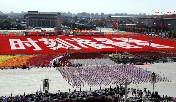 The background phalanxes form Chinese characters meaning 'Always Ready' during the celebrations for the 60th anniversary of the founding of the People's Republic of China, in central Beijing, capital of China, October 1, 2009.