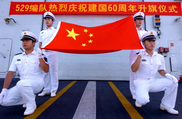 A flag-raising ceremony is held to celebrate the 60th anniversary of the founding of the People&apos;s Republic of China on Chinese navy&apos;s Zhoushan missile in the Gulf of Aden, October 1, 2009.