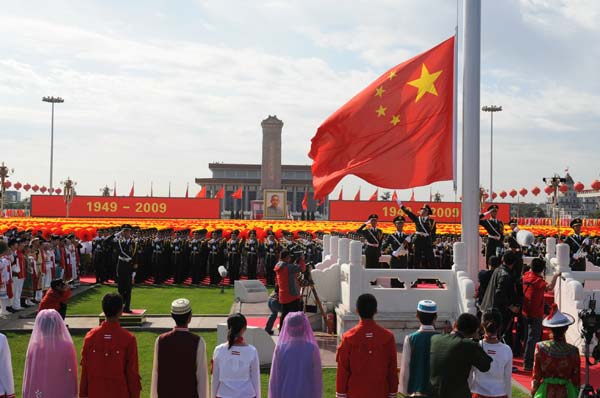 The national flag-raising ceremony is held at the start of the celebrations for the 60th anniversary of the founding of the People&apos;s Republic of China, on the Tian&apos;anmen Square in central Beijing, capital of China, October 1, 2009.