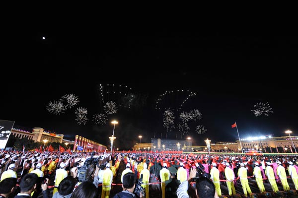 Fireworks depicting the number 60 are seen in the celebrations for the 60th anniversary of the founding of the People&apos;s Republic of China, on the Tian&apos;anmen Square in central Beijing, capital of China, October 1, 2009. 