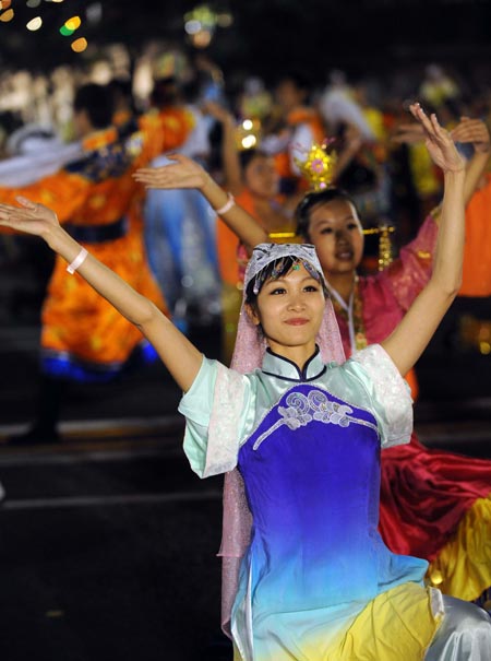 Farmer performers dance during the grand evening gala celebrating the 60th anniversary of the founding of the People&apos;s Republic of China, October 1, 2009. 