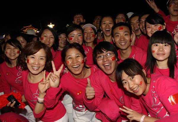 People gesture during a grand performance staged in the celebrations for the 60th anniversary of the founding of the People's Republic of China, on the Tian'anmen Square in central Beijing, capital of China, October 1, 2009.