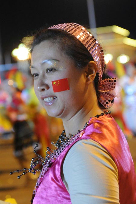 People dance in the grand evening gala for the 60th anniversary of the founding of the People's Republic of China, on the Tian'anmen Square in central Beijing, capital of China, October 1, 2009.