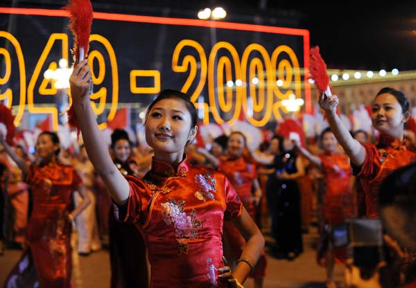 Performers dance during the grand evening gala celebrating the 60th anniversary of the founding of the People's Republic of China, on the Tian'anmen Square in central Beijing, October 1, 2009.