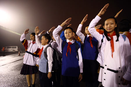 Clean streets replete with national flags, major road intersections adorned with ornate potted plants, Beijing is in gala attire early Thursday for the massive celebration commemorating the 60th founding anniversary of the People's Republic of China.