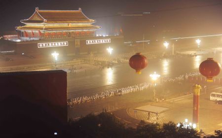 People participating in the massive celebrations take their positions in front of Tian&apos;anmen in the early morning in Beijing, on Oct. 1, 2009.(Xinhua/Xu Jiajun)