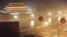 People participating in the massive celebrations take their positions in front of Tian'anmen in the early morning in Beijing, on October 1, 2009.