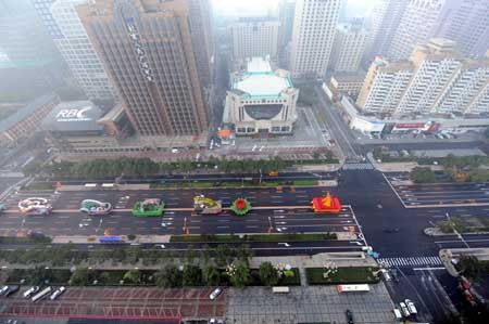 Floats move to a designated place to prepare for the celebrations for the 60th anniversary of the founding of the People's Republic of China, in Beijing, capital of China, Oct. 1, 2009. (Xinhua/Xu Liang)