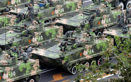 Vehicles are seen ahead of the parade of the celebrations for the 60th anniversary of the founding of the People's Republic of China in Beijing, Oct. 1, 2009. (Xinhua/Zhou Jingbo)