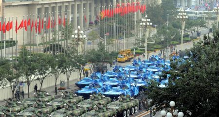 Vehicles are seen ahead of the parade of the celebrations for the 60th anniversary of the founding of the People's Republic of China in Beijing, Oct. 1, 2009. (Xinhua/Zhou Jingbo)