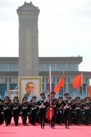 Guards of the national flag set out from the Monument to the People's Heroes for the national flag-raising ceremony at the start of the celebrations for the 60th anniversary of the founding of the People's Republic of China, on the Tian'anmen Square in central Beijing, capital of China, Oct. 1, 2009. (Xinhua/Wang Xiaochuan)