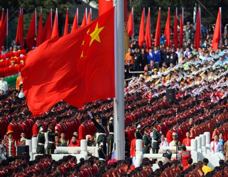 Guards of the national flag hold the national flag-raising ceremony at the start of the celebrations for the 60th anniversary of the founding of the People's Republic of China, on the Tian'anmen Square in central Beijing, capital of China, Oct. 1, 2009. (Xinhua/Gong Lei)