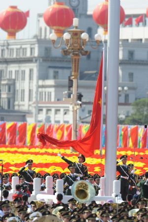 Guards of the national flag raise national flag at the start of the celebrations for the 60th anniversary of the founding of the People's Republic of China, on the Tian'anmen Square in central Beijing, capital of China, Oct. 1, 2009. (Xinhua/Li Xiaoguo)